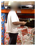 overweight male shopping for high sugar cereal